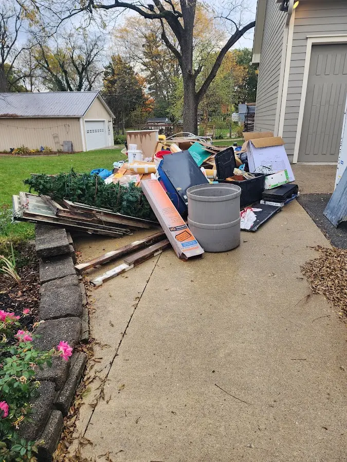 Dumpster being loaded with debris for Commercial Dumpster Rental in Skokie